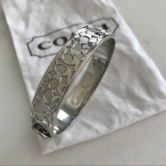 Coach cuff bracelet in silver color.